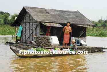 Man Standing by House
