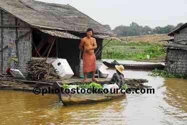 Man Standing by House