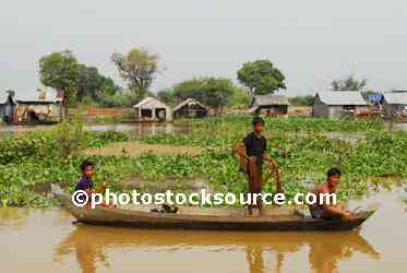 Boys Fishing From Canoe