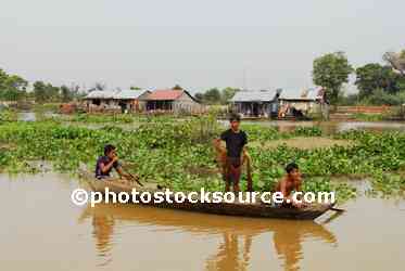 Boys Fishing From Canoe