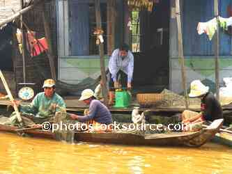 People Scaling Fish