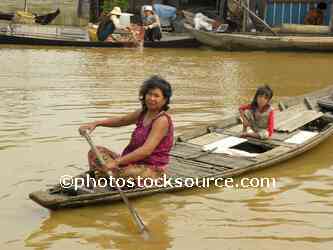 Woman Paddling Canoe