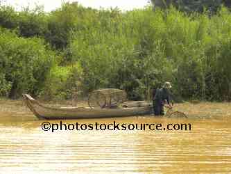 Man Setting Fish Traps