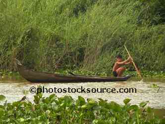 Boy Paddling Canoe