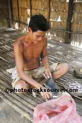 Man Cutting Up Fish