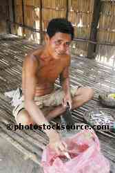 Man Cutting Up Fish