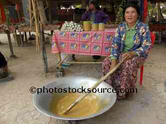 Woman Stirring Palm Sugar