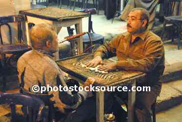 Men Playing Dominoes