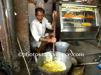 Man Making Usli Ghee