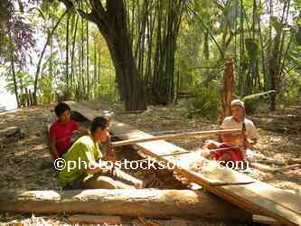 Men Sawing Log