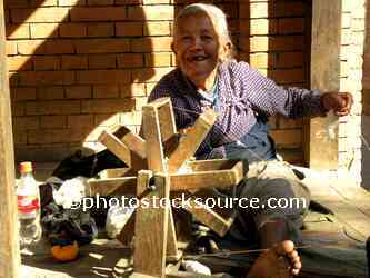 Old Lady Spinning Yarn