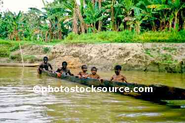 Boys in dugout canoe
