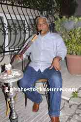 Smoking a Nargile Pipe