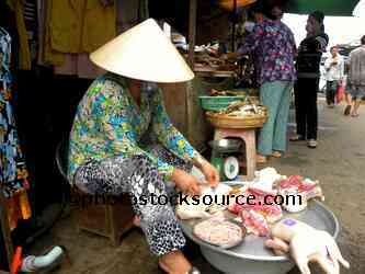 Woman Selling Chicken