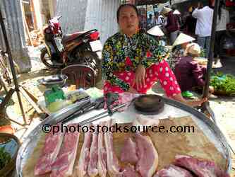 Woman Selling Pork Meat