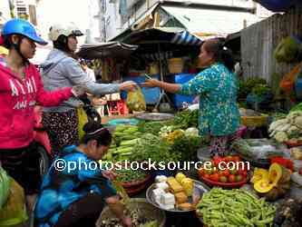 Woman Selling Vegetables