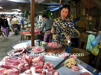 Woman Chopping Meat